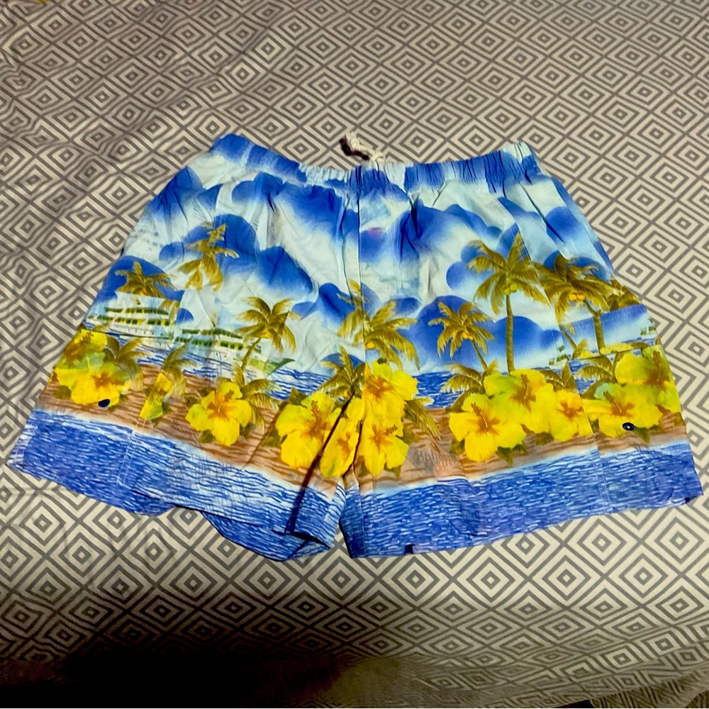 A swim trunk with an intricate design on it. Size large and material 100% Nylon